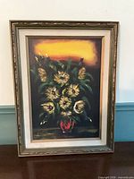 Front view of framed floral painting