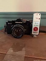 Front view of Miranda DX-3 camera with lens and flash attached