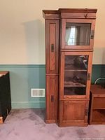 Full view of cabinet showing overall design and glass doors