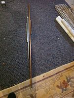 All rods and tubes laid out on floor to show full lengths.