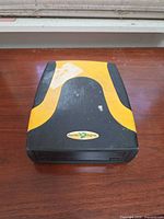 Top view showing yellow and black casing with Pacific Digital logo