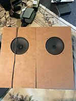 Front view of both MDF speakers showing 8-inch drivers