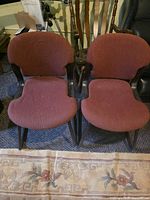 Front view of both burgundy armless cantilever chairs