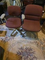 Pair of burgundy office chairs side by side