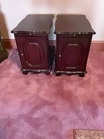 Front view of both matching mahogany end tables