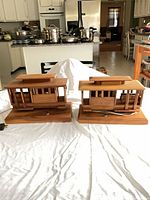 Pair of wooden cable car lamps on bases, full view