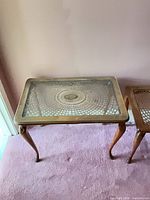 rectangular end table showing cane panel under glass