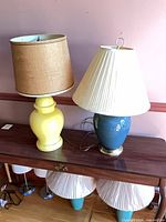 Both lamps on console table showing overall forms and shades