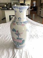 front view of porcelain vase showing bird and floral motif