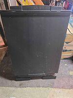Front view of folded black easel