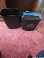 Shredder and separate waste bin side by side