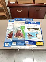 Three boxes of Royal Sovereign heat-sealed laminating pouches on table