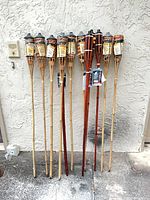 All twelve torches leaned against wall showing overall quantity and mix