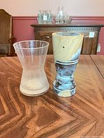 Both vases side by side on table