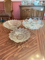 All three clear glass bowls on table