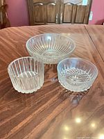 All three clear glass bowls displayed on table