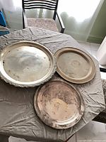 All three trays showing relative sizes and finishes