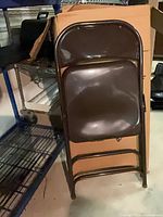 One chair leaned against shipping carton