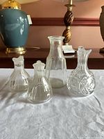 Group shot of all four clear glass pieces