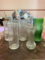 Group shot of all five glass vases on table