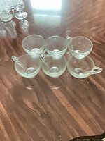 Group shot of six frosted glass teacups