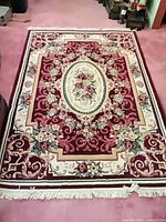 Full view of rug showing overall design, colors, size proportion, fringe