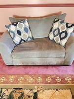 Front view of sleeper loveseat with two pillows