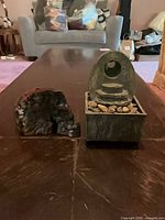 Front view showing burl root sculpture and tabletop fountain together