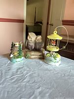 All three music box figurines grouped