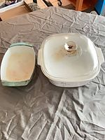 Top view of teal pan and lidded square casserole