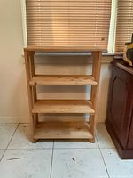 front view showing three shelves and finish