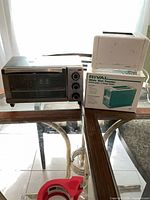 Both appliances together on glass table