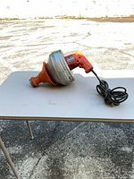 Full view of Super-Vee handheld auger on table