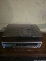 Front view with cracked dust cover closed