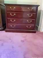 Front view showing dresser with two drawers and brass hardware