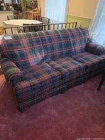 Front view of plaid 3-seat sofa