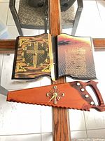 Book-shaped clock open with saw-shaped clock below