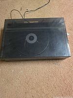 Turntable closed with dust cover showing overall condition