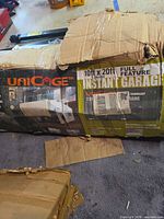 Damaged carton showing Unicage branding and 10 ft x 20 ft size