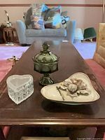 Lot overview showing green glass compote and ceramic covered dish on table