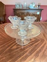 Cake stand with three dessert dishes displayed