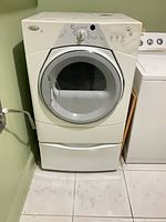 Full front view of Whirlpool Duet Sport dryer with pedestal