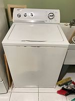 Front view of Whirlpool top-load washer showing full exterior