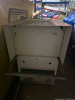 Front view showing drop-down panel and interior frame