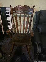Front view of brown wooden rocking chair