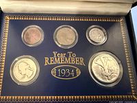 Front view of presentation case showing all five encapsulated coins