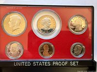 Obverse view of six 1979 proof coins in red insert display case