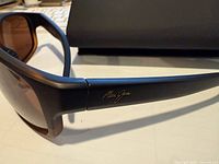 Right temple with Maui Jim signature, showing frame colour and lens tint