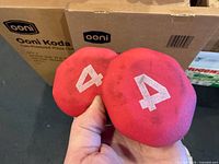 Close-up of ends showing weight marking 4 on pink neoprene