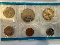1980 proof set showing six coins in teal-edged cellophane